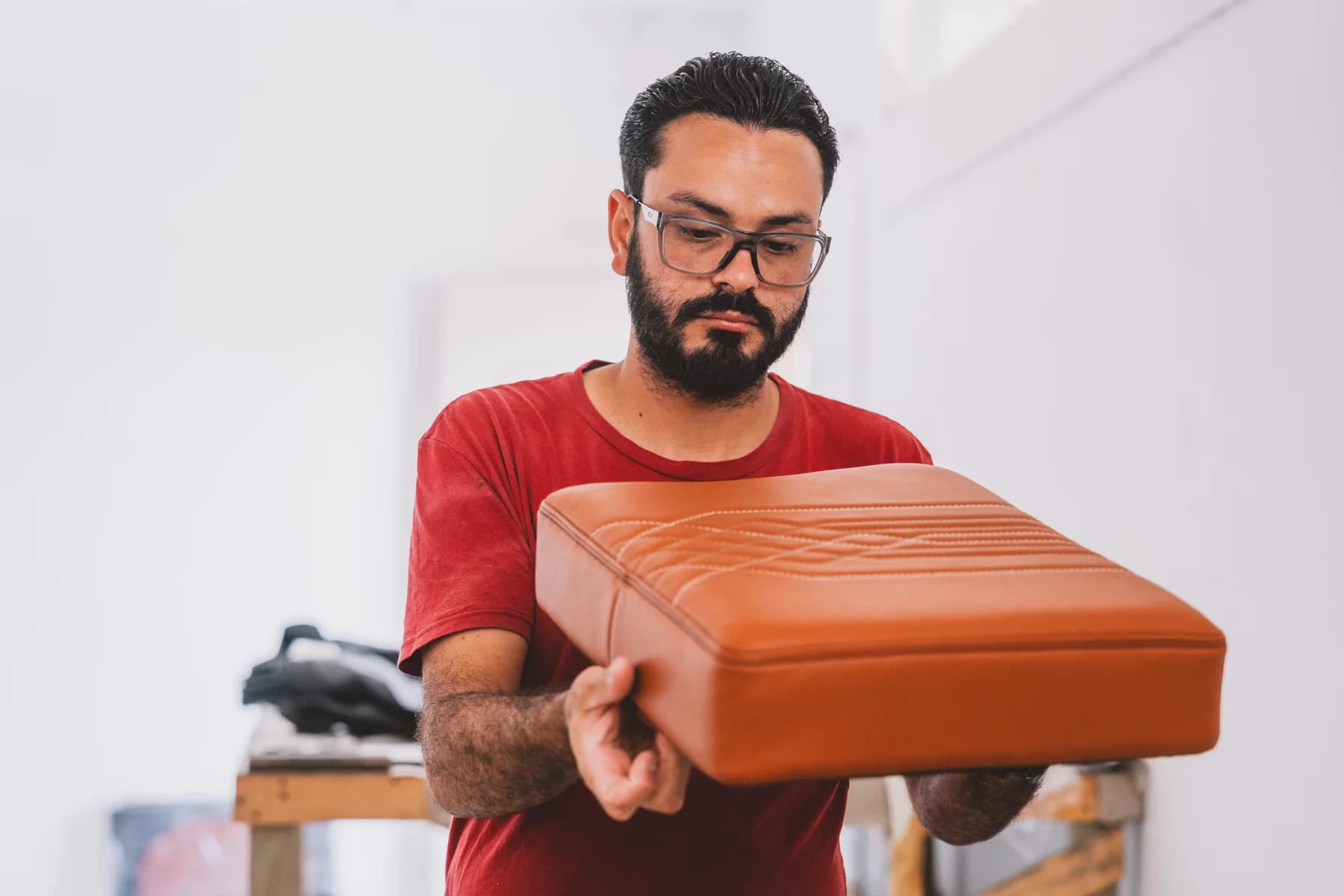Aerocorp specialist inspecting a completed aircraft seat cushion