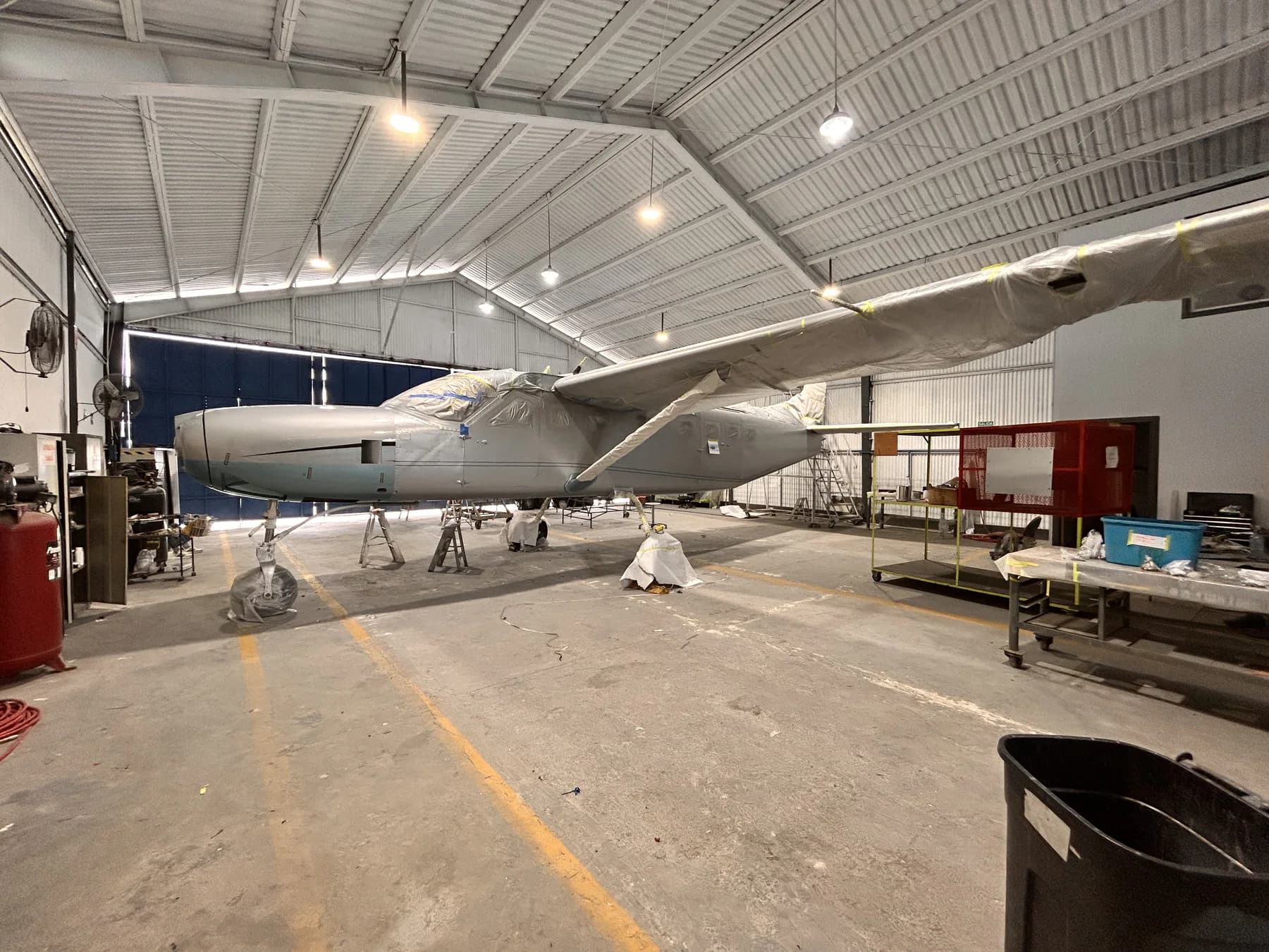 Aircraft masked and prepared for refinishing in the Aerocorp hangar